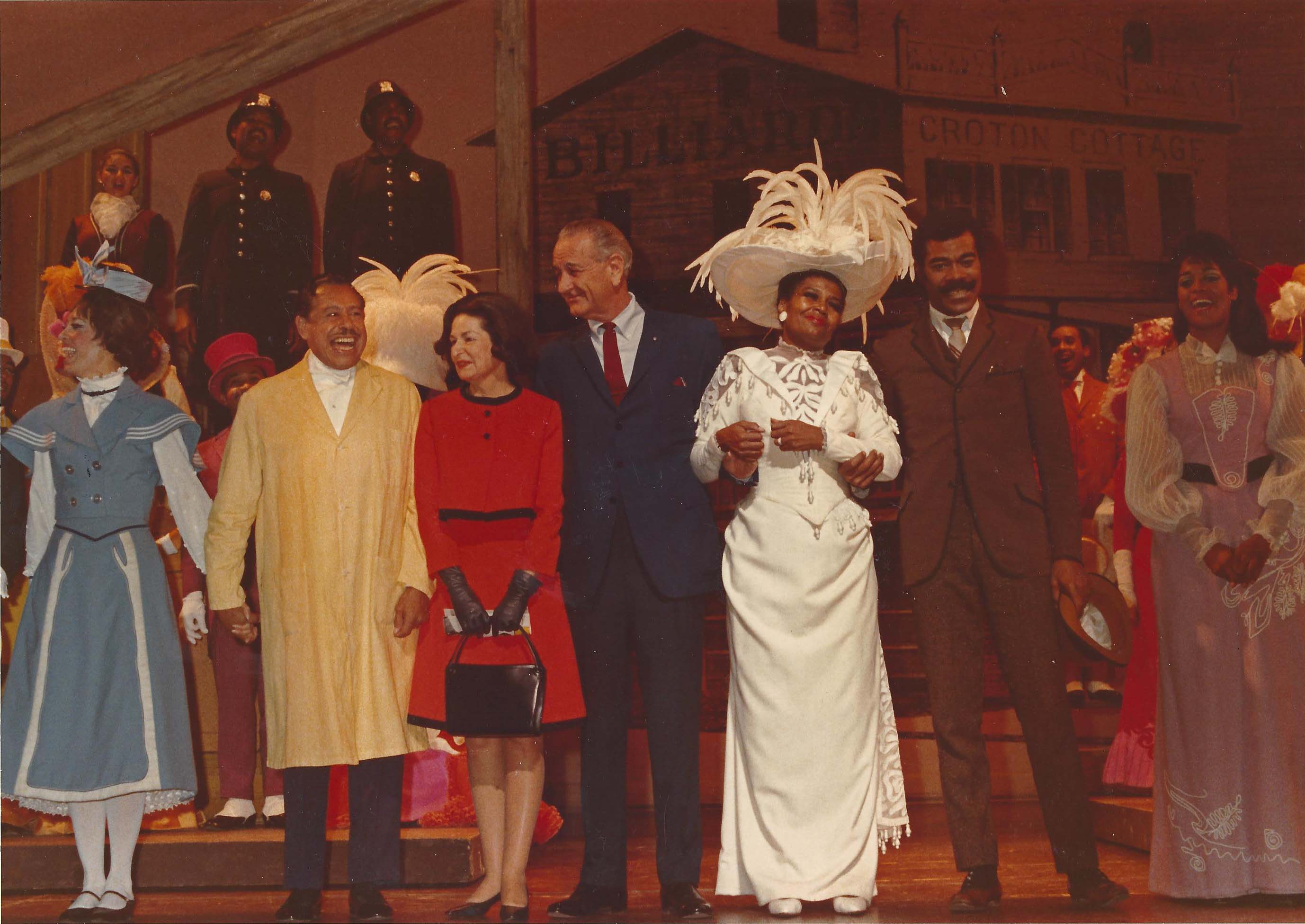 President Lyndon B Johnson and actress Pearl Bailey take a bow with the cast of Hello Dolly!